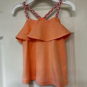 Carters 12month tank with braided strap. Color is a light coral.